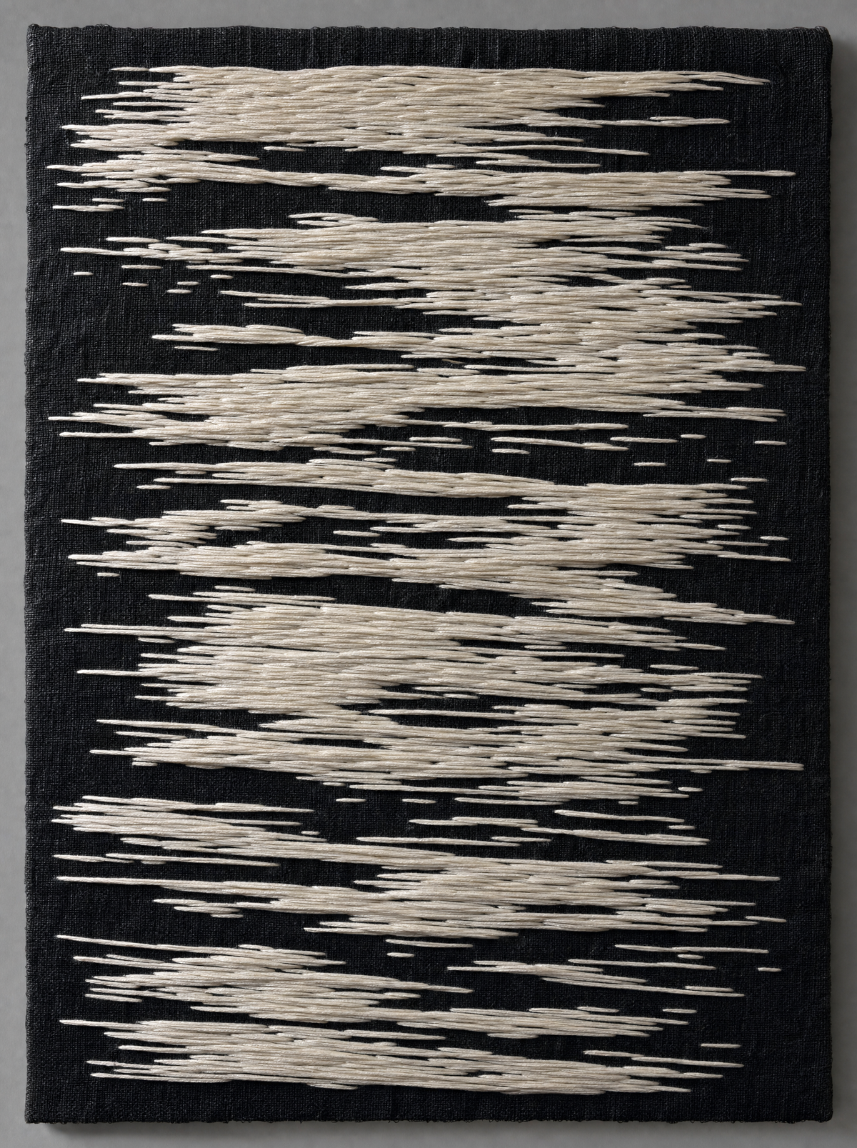 Undertow Panel, ivory satin stitch on black linen