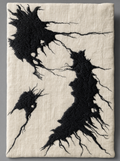 Inkwell Panel, dense black embroidery spreading across ivory linen